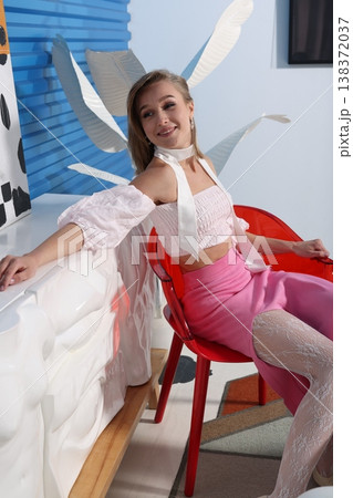 Relaxed studio environment with woman showcasing lifestyle content Relaxed studio environment with woman showcasing lifestyle content 138372037