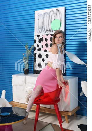 Cheerful woman displays beauty products with camera and decor 138372038