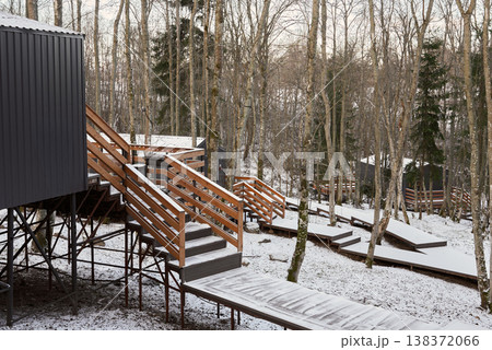 Access platform with railing connects to remote seasonal retreat Access platform with railing connects to remote seasonal retreat 138372066