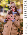 Woman expressing love and hope with heart hands gesture 138372598