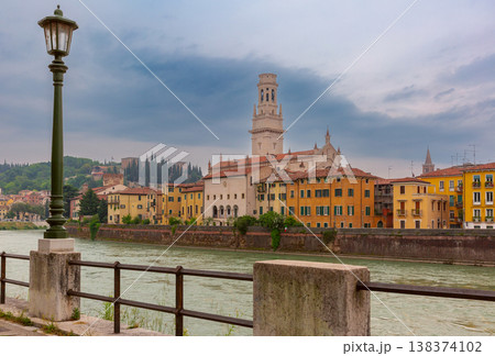Verona riverside with cathedral tower and historic buildings, Italy 138374102