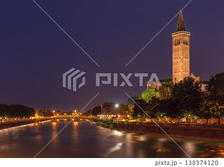 Verona riverside at night with cathedral tower and Adige River, Italy 138374120