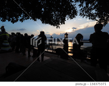 Silhouette photographer sunset river reflection tourist travel landscape peaceful sunset river view with photographer group Silhouette photographer sunset river reflection tourist travel landscape peaceful sunset river view with photographer group 138375371