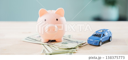 Pink piggy bank to save money for auto car fuel and refinance loan, finance gas transportation cost while managing personal budget for monthly vehicle insurance and drive cost Pink piggy bank to save money for auto car fuel and refinance loan, finance gas transportation cost while managing personal budget for monthly vehicle insurance and drive cost 138375773
