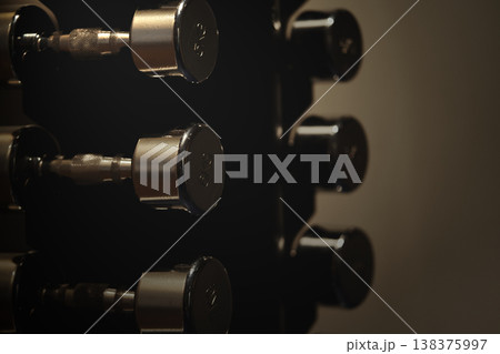 Monochrome Image Showing Dumbbell Rack Emphasizing Fitness And Strength Focus Monochrome Image Showing Dumbbell Rack Emphasizing Fitness And Strength Focus 138375997