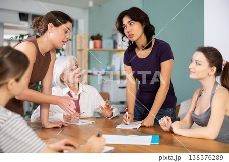 Female participate sit at circle, chatting, talking Female participate sit at circle, chatting, talking 138376289