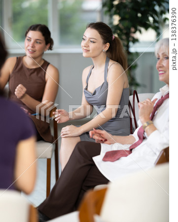 Female participate sit at circle, chatting, talking Female participate sit at circle, chatting, talking 138376390