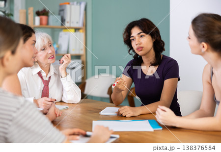 Female participate sit at circle, chatting, talking Female participate sit at circle, chatting, talking 138376584