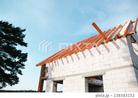 Contemporary house with wooden roof lags installed, brick and block walls, stropil system evolve, building covered by home insurance and construction loan. Contemporary house with wooden roof lags installed, brick and block walls, stropil system evolve, building covered by home insurance and construction loan. 138383152