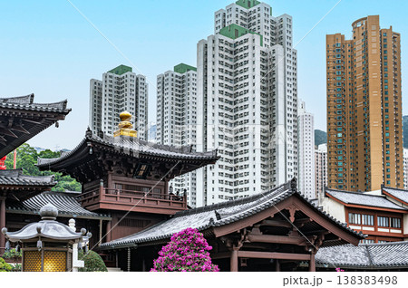 Traditional Chinese wooden architecture Chi Lin Nunnery contrast modern residential skyscrapers high rise buildings background Hong Kong city culture landmark view Traditional Chinese wooden architecture Chi Lin Nunnery contrast modern residential skyscrapers high rise buildings background Hong Kong city culture landmark view 138383498