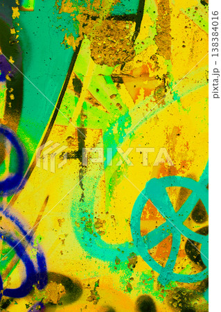 Yellow and Teal Graffiti Texture on Weathered Concrete Wall 138384016