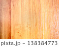 Close-up view of a warm toned wooden surface with distinct grain patterns 138384773
