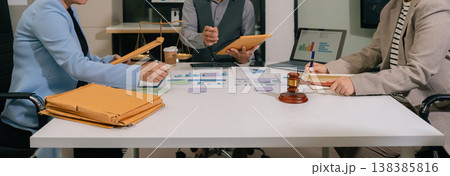 eamwork of business lawyer meeting working hard about legal legislation in courtroom to help their customer. 138385816
