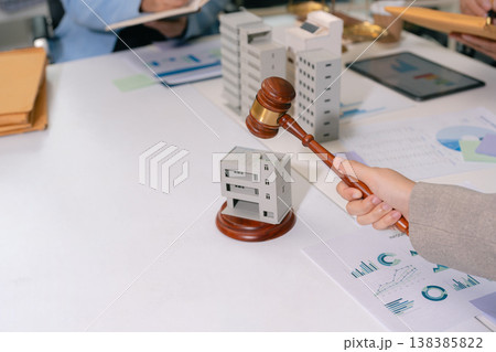 Justice and law concept. Real Estate Law in a courtroom the gavel, working with digital tablet computer. Justice and law concept. Real Estate Law in a courtroom the gavel, working with digital tablet computer. 138385822