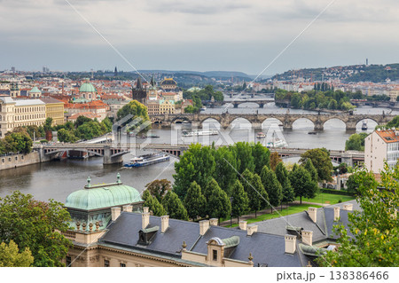 Panoramic view of Prague cityscape with Charles Bridge over Vltava River, historic architecture and multiple bridges in European travel destination Panoramic view of Prague cityscape with Charles Bridge over Vltava River, historic architecture and multiple bridges in European travel destination 138386466