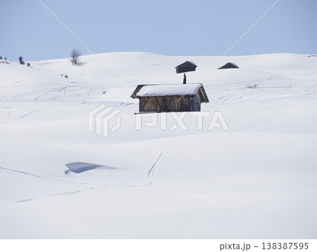 wooden hut covered by snow in armentarola pralongia dolomites mountains panorama 138387595
