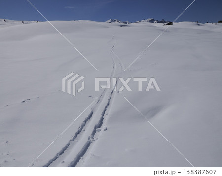 alpine ski tracks on the snow in dolomites mountains alpine ski tracks on the snow in dolomites mountains 138387607