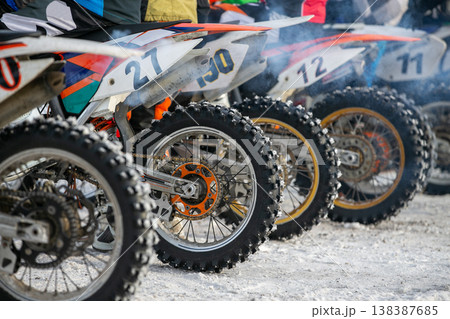 Row motocross dirt bikes lined up 138387685