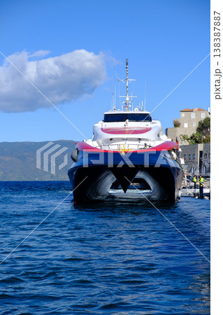 High-Speed Travel of a Catamaran Ferry Docked in Hydra High-Speed Travel of a Catamaran Ferry Docked in Hydra 138387887