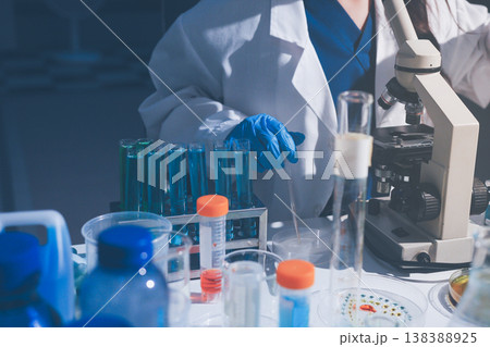 Science, laboratory and woman with pipette, test tube and biotech solution in research. Medical innovation, scientist or lab technician in study for healthcare, medicine and vaccine results feedback. Science, laboratory and woman with pipette, test tube and biotech solution in research. Medical innovation, scientist or lab technician in study for healthcare, medicine and vaccine results feedback. 138388925