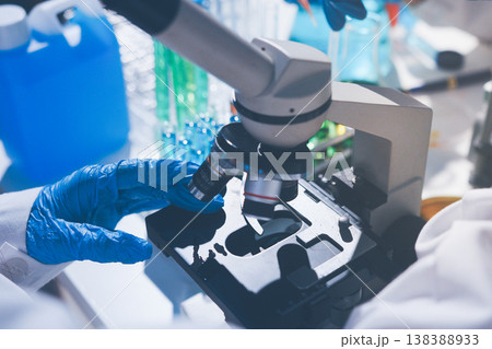 Science, laboratory and woman with pipette, test tube and biotech solution in research. Medical innovation, scientist or lab technician in study for healthcare, medicine and vaccine results feedback. 138388933