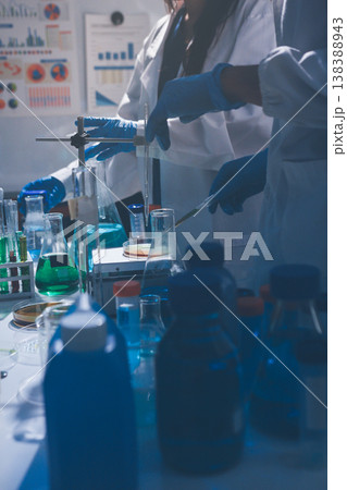 Science, laboratory and woman with pipette, test tube and biotech solution in research. Medical innovation, scientist or lab technician in study for healthcare, medicine and vaccine results feedback. Science, laboratory and woman with pipette, test tube and biotech solution in research. Medical innovation, scientist or lab technician in study for healthcare, medicine and vaccine results feedback. 138388943