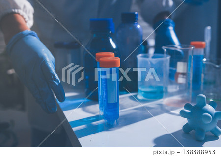 Science, laboratory and woman with pipette, test tube and biotech solution in research. Medical innovation, scientist or lab technician in study for healthcare, medicine and vaccine results feedback. 138388953
