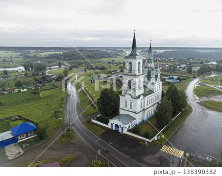 Aerial drone view of Transfiguration Church (Spaso-Preobrazhenskaya Church) in Nizhnyaya Sinyachikha, Russia, rainy summer day, wooden architecture 138390382