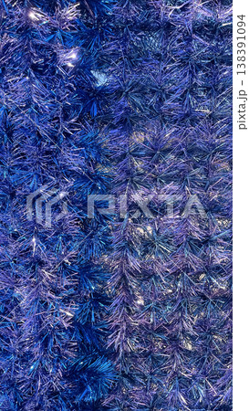 Full frame background of shimmering blue and violet metallic tinsel with festive sparkling texture Full frame background of shimmering blue and violet metallic tinsel with festive sparkling texture 138391094