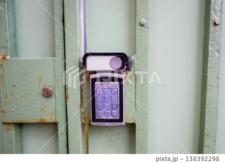 Electronic keypad access control system on metal gate with security code lock and modern entry protection concept Electronic keypad access control system on metal gate with security code lock and modern entry protection concept 138392298