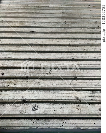 Rusty metal slats with paw prints gritty, rhythmic, and rich in industrial texture and story. Rusty metal slats with paw prints gritty, rhythmic, and rich in industrial texture and story. 138392783