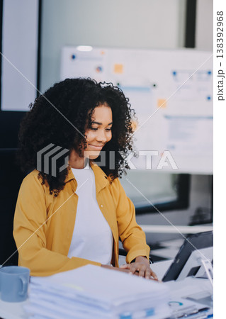 Serious, laptop and professional businesswoman sitting and reading a work email with a pen working from home. Business, computer and focused female lawyer in modern office preparing for a case. Serious, laptop and professional businesswoman sitting and reading a work email with a pen working from home. Business, computer and focused female lawyer in modern office preparing for a case. 138392968