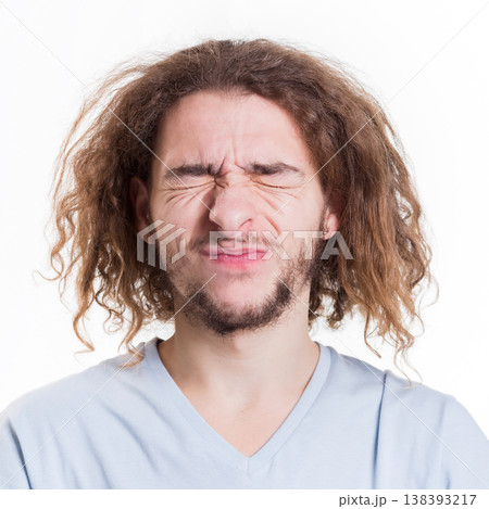 Basic emotions. Man expressing disgust on face, grimacing while standing against white studio background, cutout 138393217