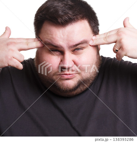 Stressed exhausted man with fingers on temple suffering from headache, white isolated studio background Stressed exhausted man with fingers on temple suffering from headache, white isolated studio background 138393286