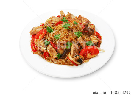 Asian food. Fried Thai glass Rice noodles with meat and vegetables. Chinese transparent glass rice vermicelli fried with meat, parsley and tomatoes. Korean funchoza cellophane noodles. Asian food. Fried Thai glass Rice noodles with meat and vegetables. Chinese transparent glass rice vermicelli fried with meat, parsley and tomatoes. Korean funchoza cellophane noodles. 138393297