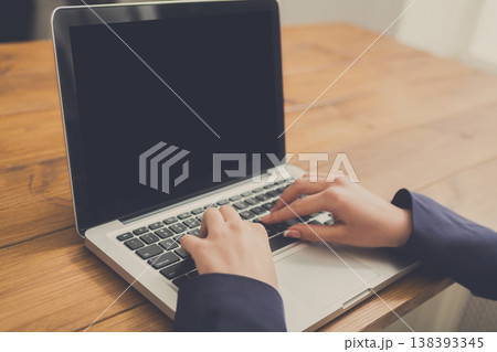 Female hands typing on laptop, close-up, shallow depth of field. Business woman in office Female hands typing on laptop, close-up, shallow depth of field. Business woman in office 138393345