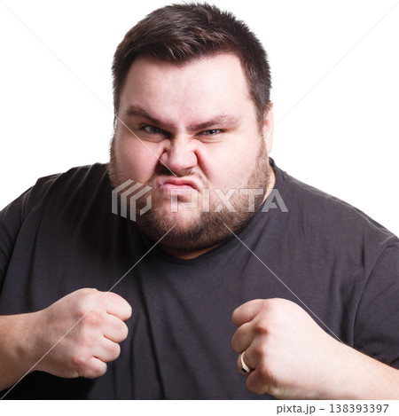 Feeling furious. Fighting fat man holding fists clenched, expressing anger, white isolated studio background Feeling furious. Fighting fat man holding fists clenched, expressing anger, white isolated studio background 138393397