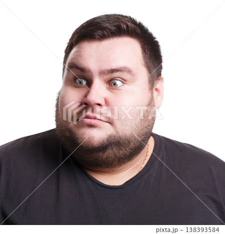 Shocking news. Surprised fat man expressing amaze on face, standing on white isolated background, studio shot 138393584