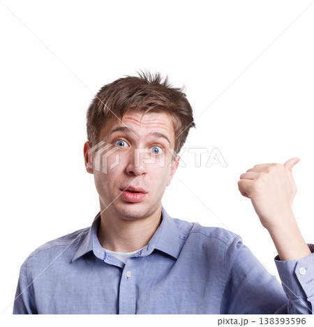 Can't believe it. Surprised man with thumb-up gesture expressing amaze on face, standing on white isolated background, studio shot 138393596