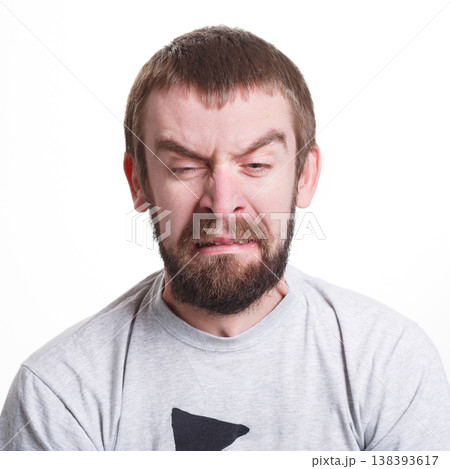 Emotions, facial expressions. Man expressing disgust while standing on white isolated studio background, copy space Emotions, facial expressions. Man expressing disgust while standing on white isolated studio background, copy space 138393617