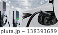 Electric Car Charging Station with EV Plug Connected to Vehicle 138393689