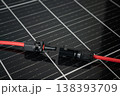MC4 solar connector cable unplugged on photovoltaic panel close up 138393709