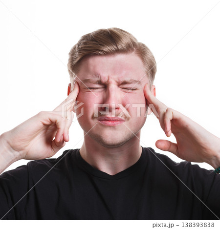 Under pressure. Concentrated tense stressed man, holding fingers on temple, white isolated studio background 138393838