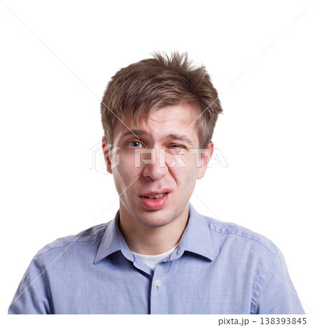 Emotions, facial expressions. Man expressing disgust while standing on white isolated studio background, copy space Emotions, facial expressions. Man expressing disgust while standing on white isolated studio background, copy space 138393845