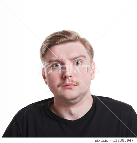 Surprised. Wonder man expressing amaze on face, standing on white isolated background, studio shot Surprised. Wonder man expressing amaze on face, standing on white isolated background, studio shot 138393947