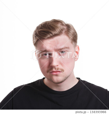 Disappointed. Negative emotion. Man with sad face, grimacing on white studio background, cutout 138393966
