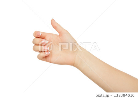 Female hand holding card, phone or other, close-up, cutout, isolated on white background. Female hand holding card, phone or other, close-up, cutout, isolated on white background. 138394010