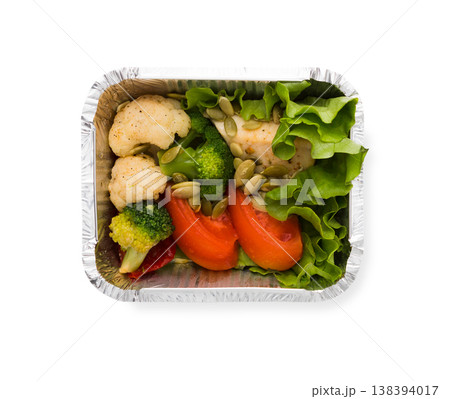Healthy food restaurant delivery and diet concept. Take away meal in foil box. Vegetable salad with chicken Healthy food restaurant delivery and diet concept. Take away meal in foil box. Vegetable salad with chicken 138394017