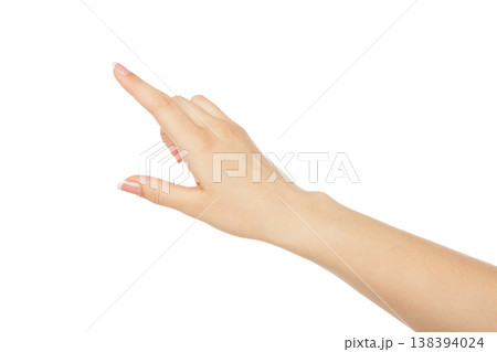 Woman's hand pointing on object with forefinger, close-up, cutout, isolated on white background. Woman's hand pointing on object with forefinger, close-up, cutout, isolated on white background. 138394024