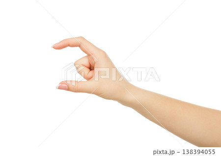 Female hand measuring invisible item, close-up, cutout, isolated on white background. 138394055